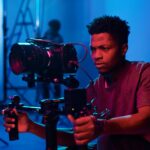 Camera operator shooting on professional camera