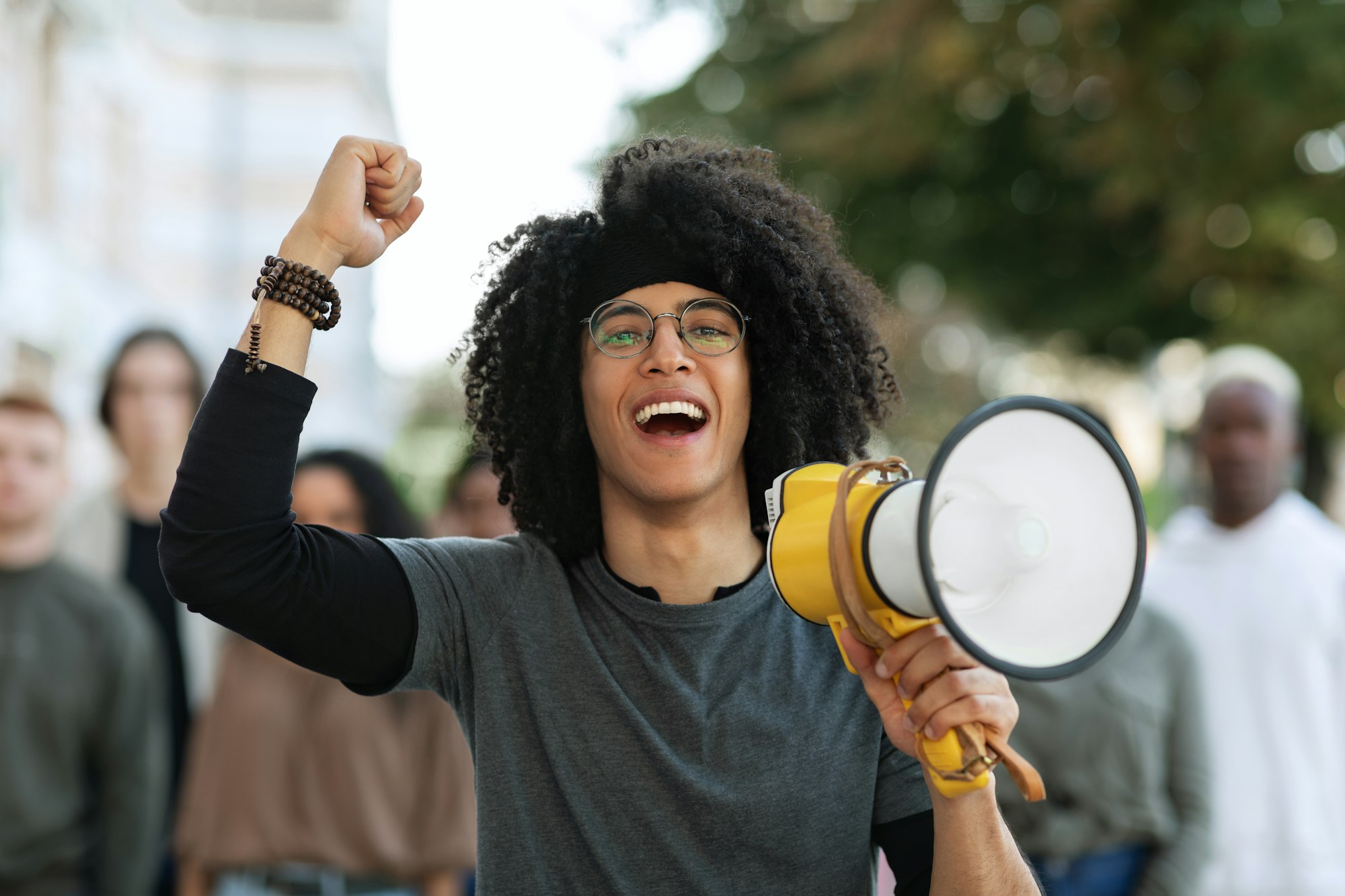 Charismatic black guy activist with megaphone on the street