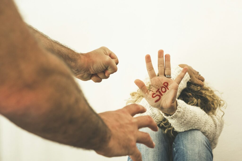 Home couple violence abuse concept with woman protect herself sitting on the floor and stop