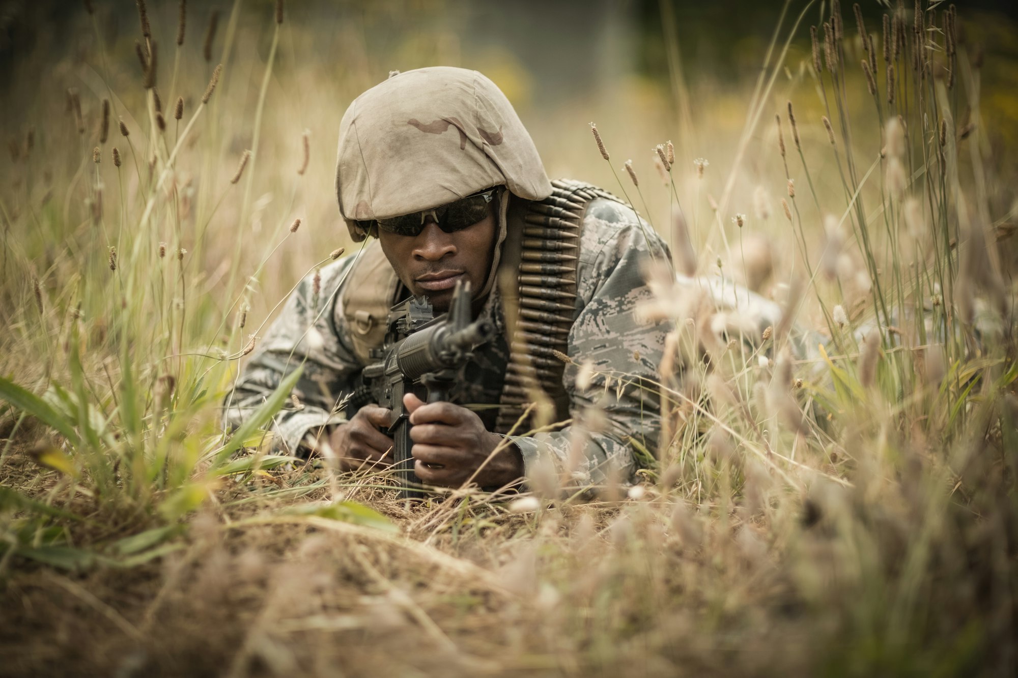 Military soldier guarding with a rifle