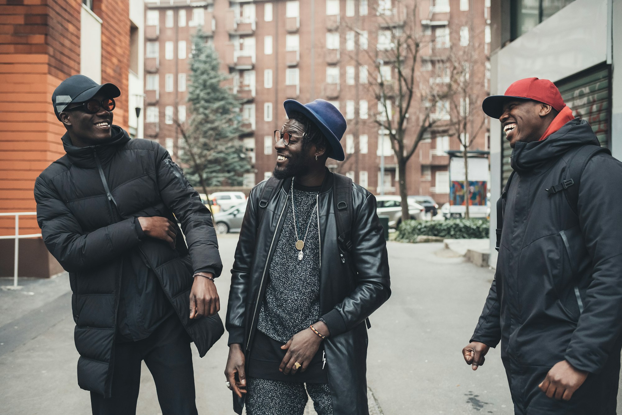 three african men greeting in the street