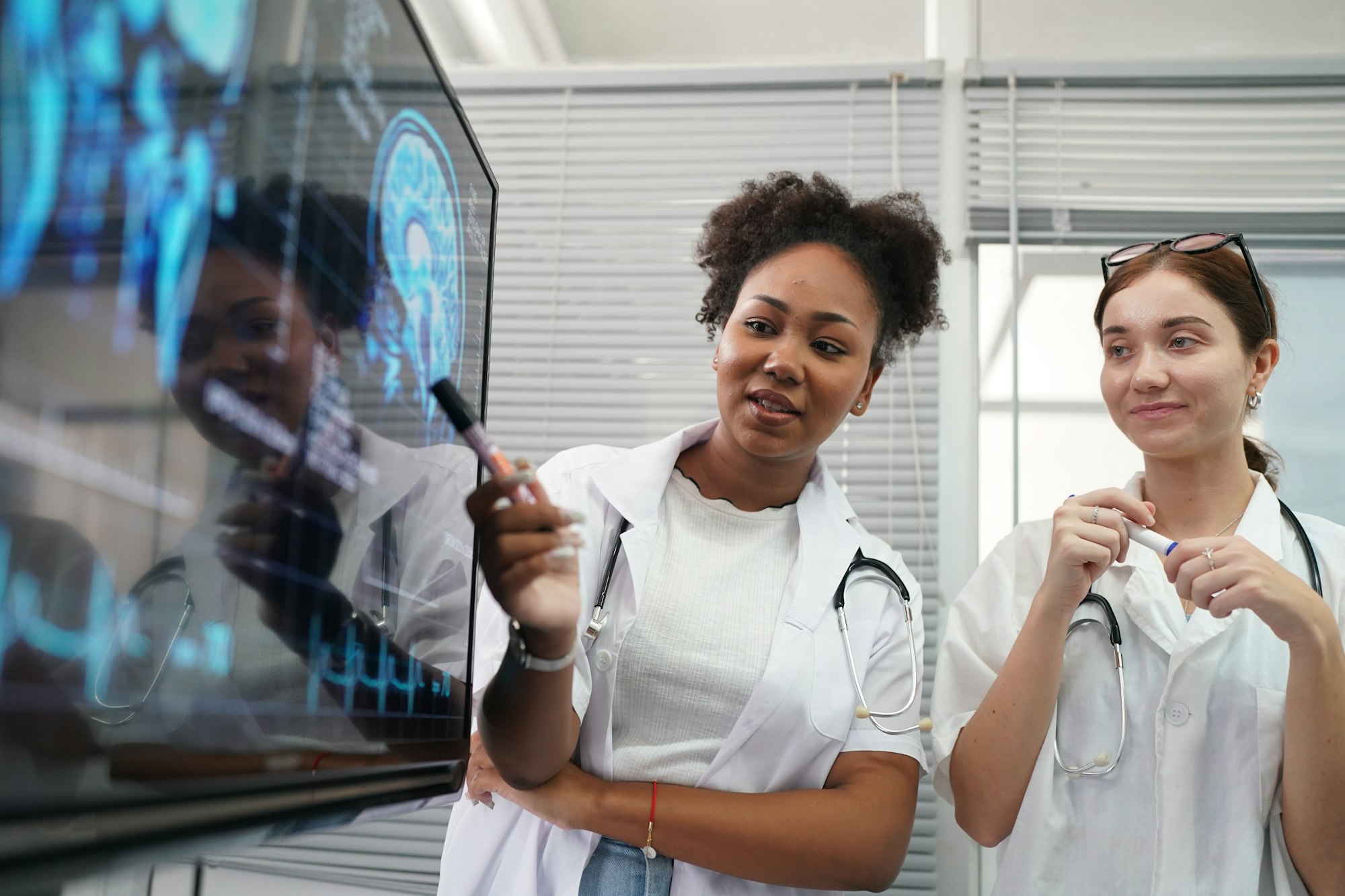 Group of doctors looking at X-ray on medical conference, discussing issues